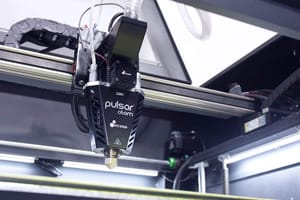 Pulsar Atom Pellet Extruder mounted on a gantry axis in a 3d printer.